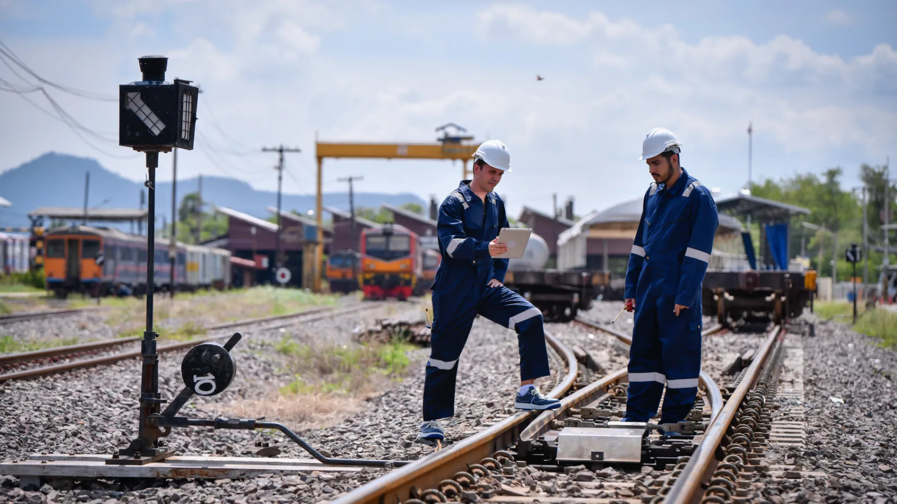 Two Rail Workers constructing on trackside. 